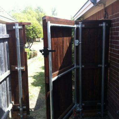 Wood Gate with Metal Frame open half way DFW Fence Contractor